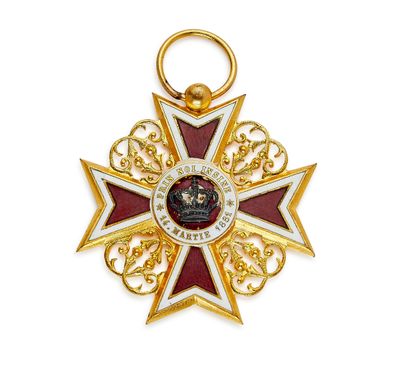 une image représentant une médaille d'or ornée d'une étoile rouge