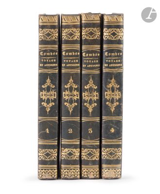 three books are lined up in a row on a white surface