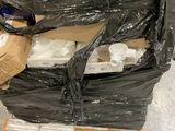 a pallet full of boxes and a pair of scissors on it