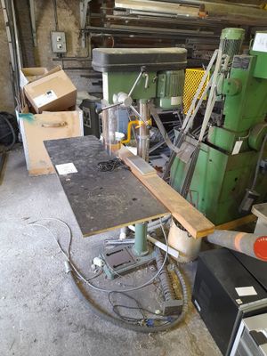 a machine that is sitting in a room with a lot of tools