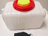 a white container with a red lid and a yellow cap