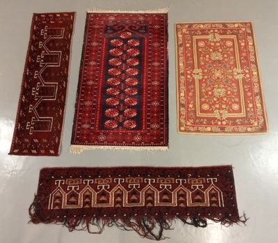 three oriental rugs on a table