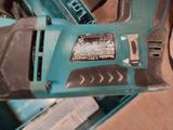 an image of a corded electric tool sitting on top of a table
