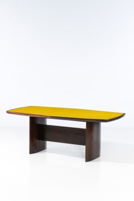 a wooden table with a yellow top on a white background