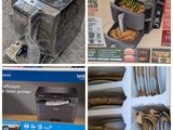 several different pictures of a printer and other items in a store
