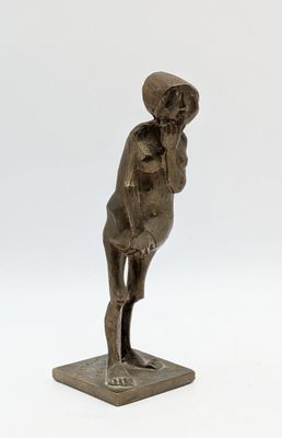 statue of a man with a hat on his head on a base