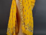 an image of a yellow scarf on a mannequin head