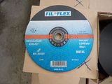 a metal disc that is sitting on a cardboard box