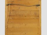 a wooden sign hanging on the wall with a rope