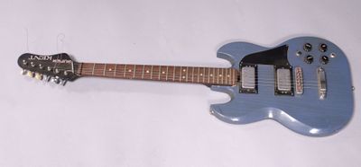 an electric guitar sitting on top of a white surface