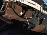 a car dashboard with a steering wheel and a steering knob