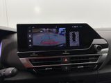 the interior of a car with a view of a camera on the dashboard