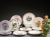 a lot of plates and bowls that are sitting on a table