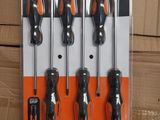 four pieces of screwdriver set in a package on top of a cardboard box