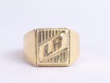an image of a gold signet ring with the letter r on it