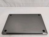 a laptop that is sitting on a white surface