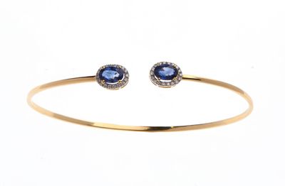 BRACELET jonc ouvrant en or jaune 750 °/°° orné de deux saph…