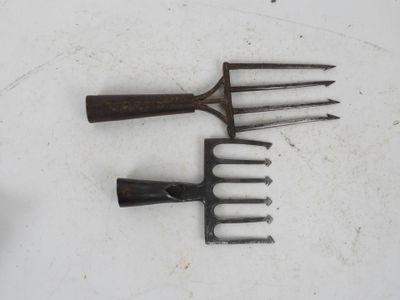 four different types of garden tools on the table