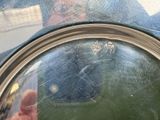 a reflection of a person in the mirror of a car