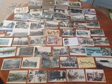 a lot of old photos on the table