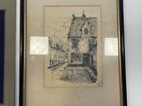 two framed pictures of a building and a picture of a street