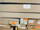 a stack of cardboard boxes on a pallet in a warehouse