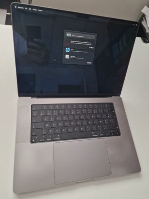 a laptop computer that is sitting on a desk