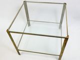 brass and glass coffee table with a glass top