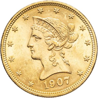 Gros plan sur une pièce d'or ornée d'une tête de femme
