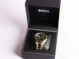 a box with a watch inside of it on a white surface