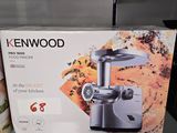 a box of kenwood meat grinder sitting on a shelf