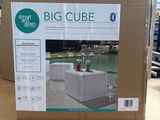 a box with a big cube inside of it on a table