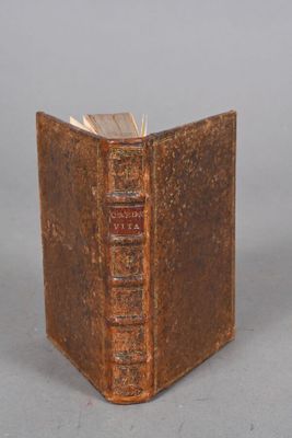 an old book that is sitting on a table