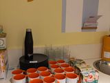 many cups of coffee on the counter in the kitchen