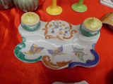 a plate with candles on it sitting on a table