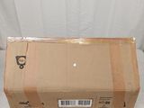 a box that is sitting on a bed with a tag on it