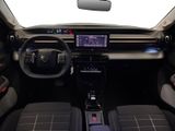 the interior of a car with a dashboard and a steering wheel