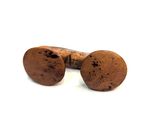 pair of corks on a white surface with a white background
