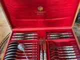 a red case with silverware in it on a table