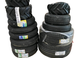 several tires stacked on top of each other on a white background