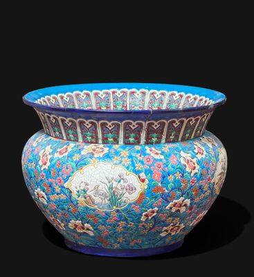 a blue vase with a design on it on a black background