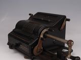 a small machine that is sitting on a white surface
