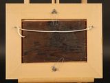 a picture of a wooden easel with a picture on it