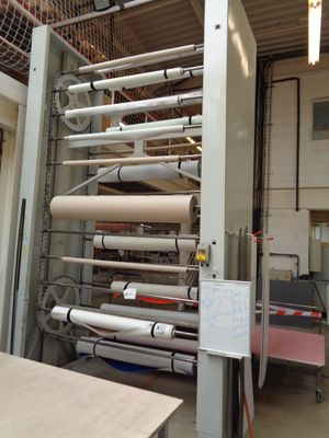 a machine that is working on a roll of paper
