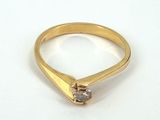 an image of a gold ring with a diamond on it