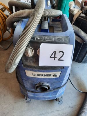 a blue machine that is sitting on the floor