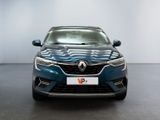 the front view of a blue car in a showroom