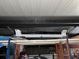 a car that is parked in a garage under a roof