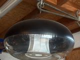 a large metal object hanging from the ceiling in a room