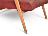 an image of a red chair with a wooden frame